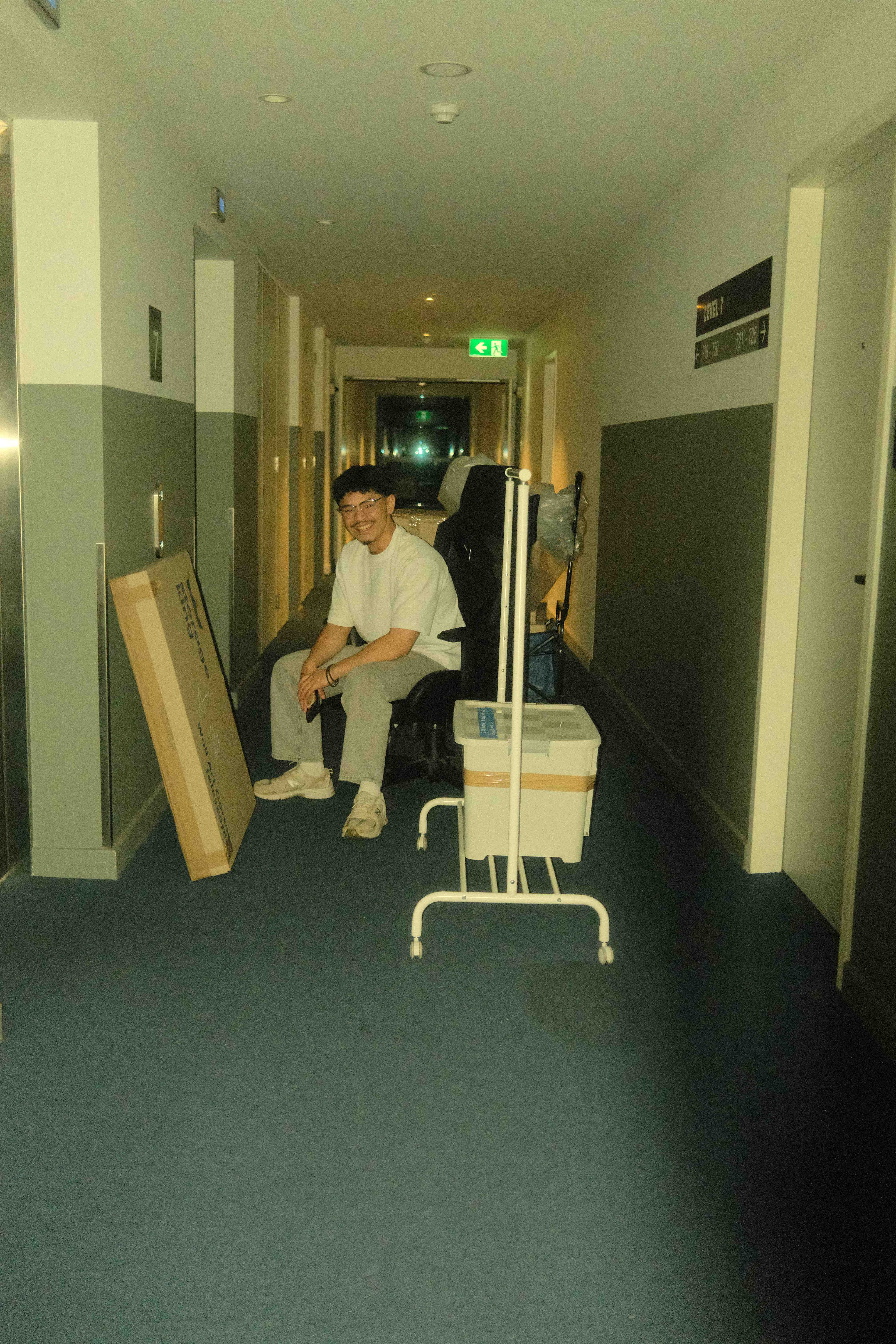 Team in hotel hallway with equipment